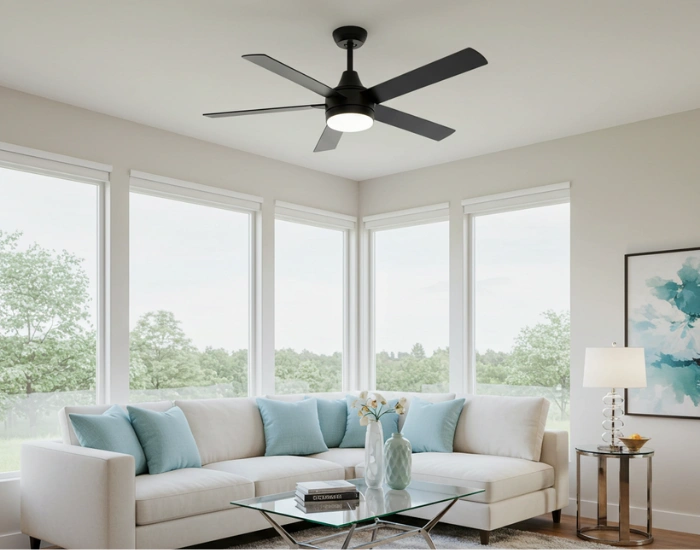 Modern living room with a ceiling fan and bright natural light.